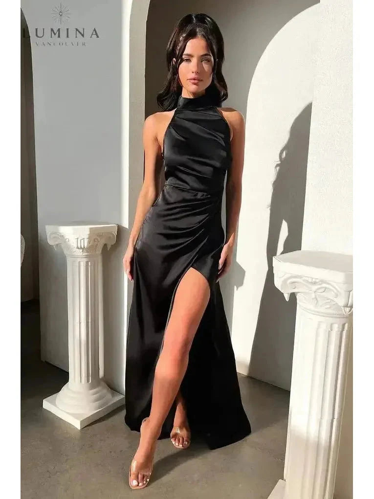 Burgundy Florencia halterneck sleeveless slit maxi dress by Lumina Wear, perfect for wedding guests, shown on a model.