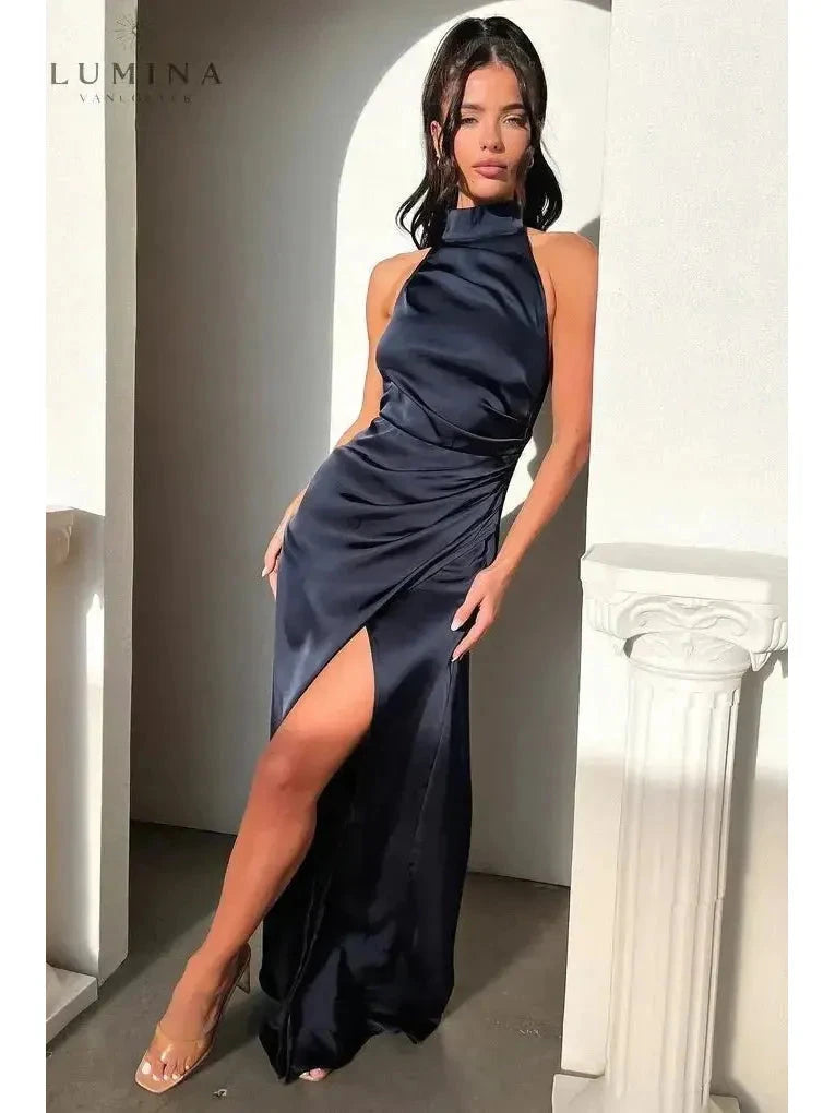 Burgundy Florencia halterneck sleeveless slit maxi dress by Lumina Wear, perfect for wedding guests, shown on a model.