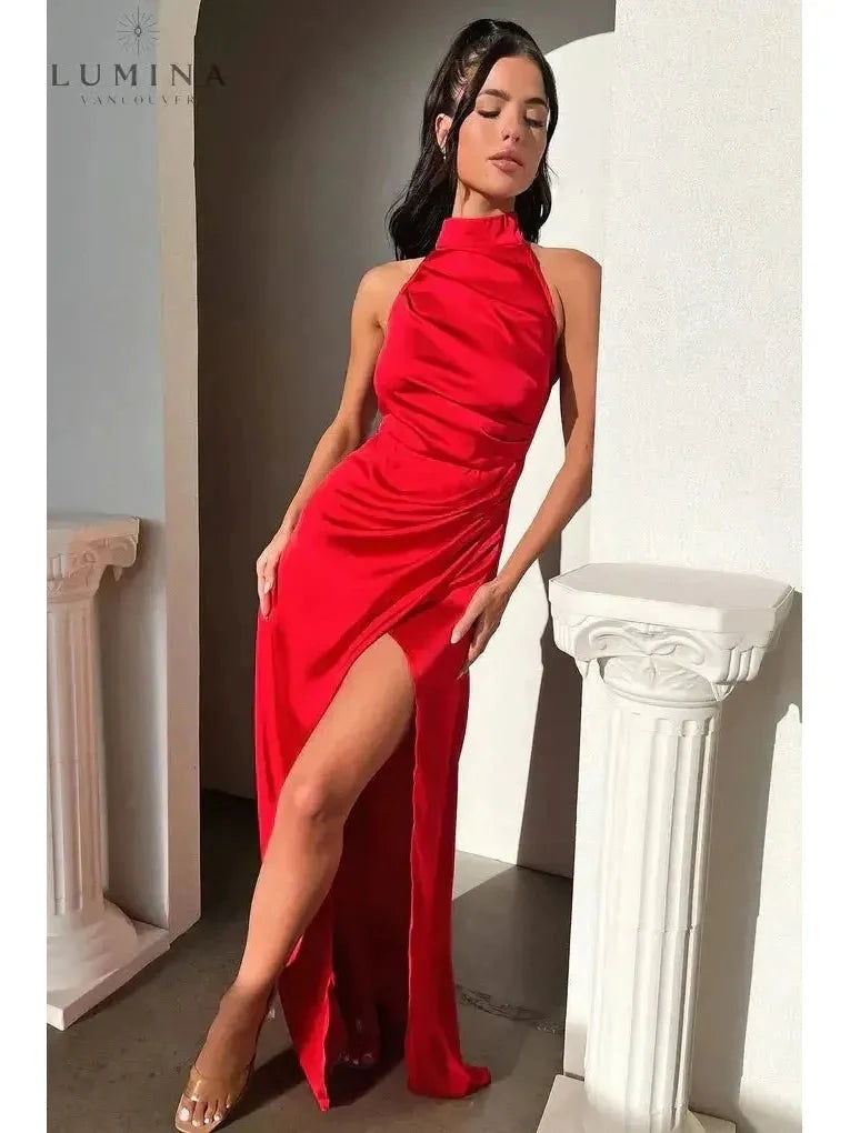 Burgundy Florencia halterneck sleeveless slit maxi dress by Lumina Wear, perfect for wedding guests, shown on a model.