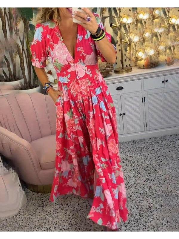 Red FLORIANA™ vibrant floral dress by Lumina Vancouver, featuring a colorful floral pattern and flowing fabric.