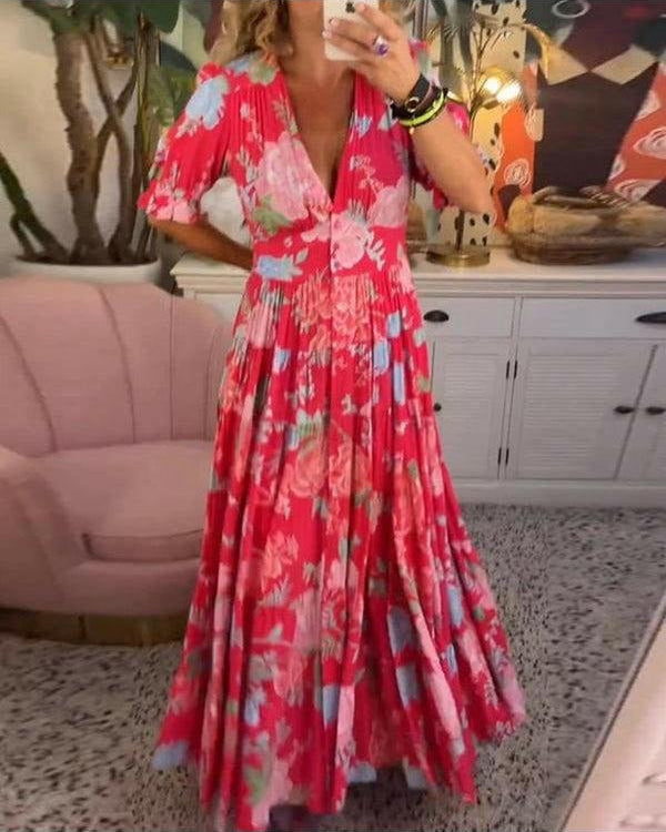 Red Floriana floral dress by Lumina Wear featuring vibrant flower patterns and a flowing, elegant design.
