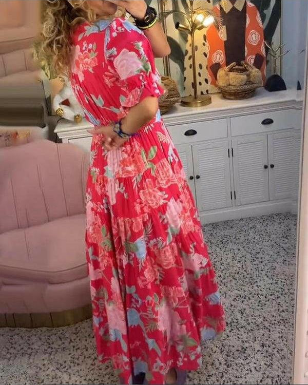 Red Floriana vibrant floral dress by Lumina Wear featuring a fitted silhouette and colorful floral pattern.