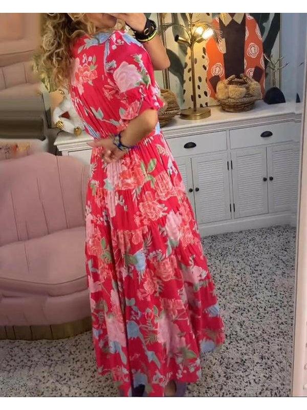 Bright red Floriana floral dress by Lumina Vancouver featuring vibrant flower patterns and a flowing silhouette.