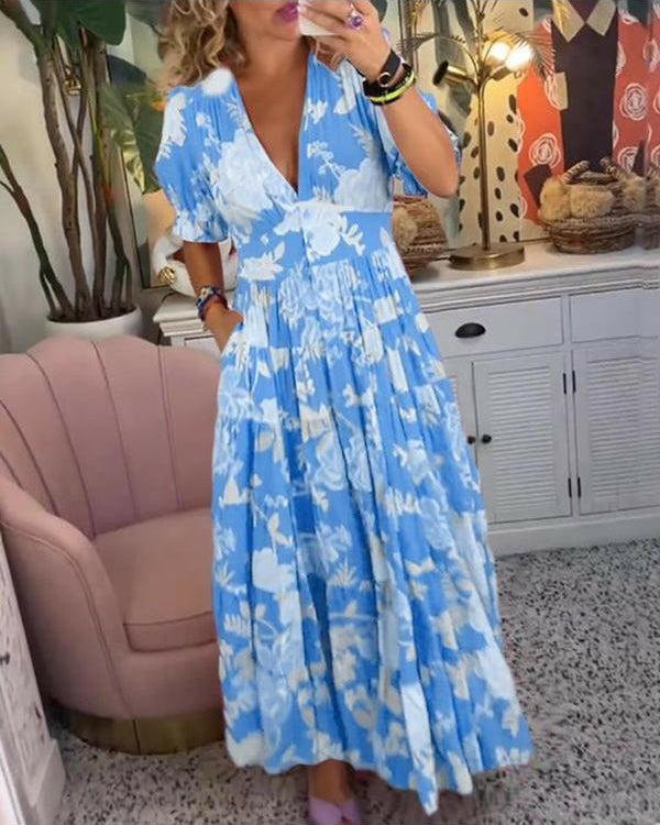 Lumina Wear Floriana vibrant floral dress in red, featuring a stylish design and lightweight fabric, perfect for summer wear.