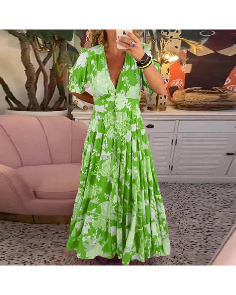 Lumina Wear Floriana vibrant floral dress in red, showcasing its colorful pattern and flowing fabric design.