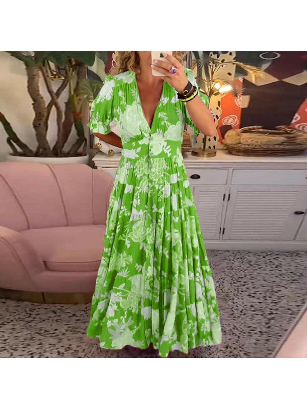 Lumina Vancouver FLORIANA™ vibrant red floral dress displayed on a mannequin, showcasing its colorful pattern and flowing design.