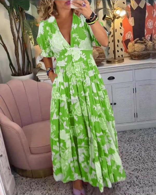 Lumina Wear Floriana vibrant floral dress in red, showcasing a stylish design perfect for warm-weather occasions.