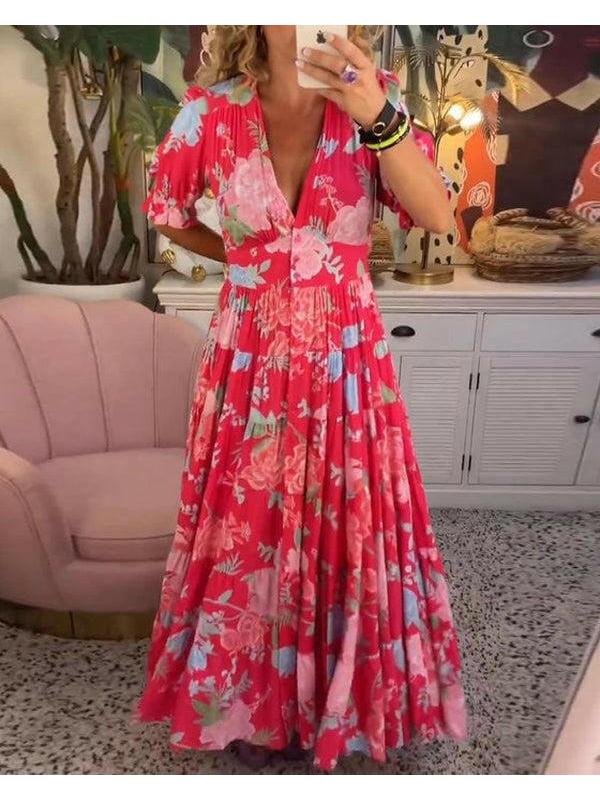 Bright red Floriana floral dress by Lumina Vancouver, featuring vibrant patterns and a flowing silhouette.