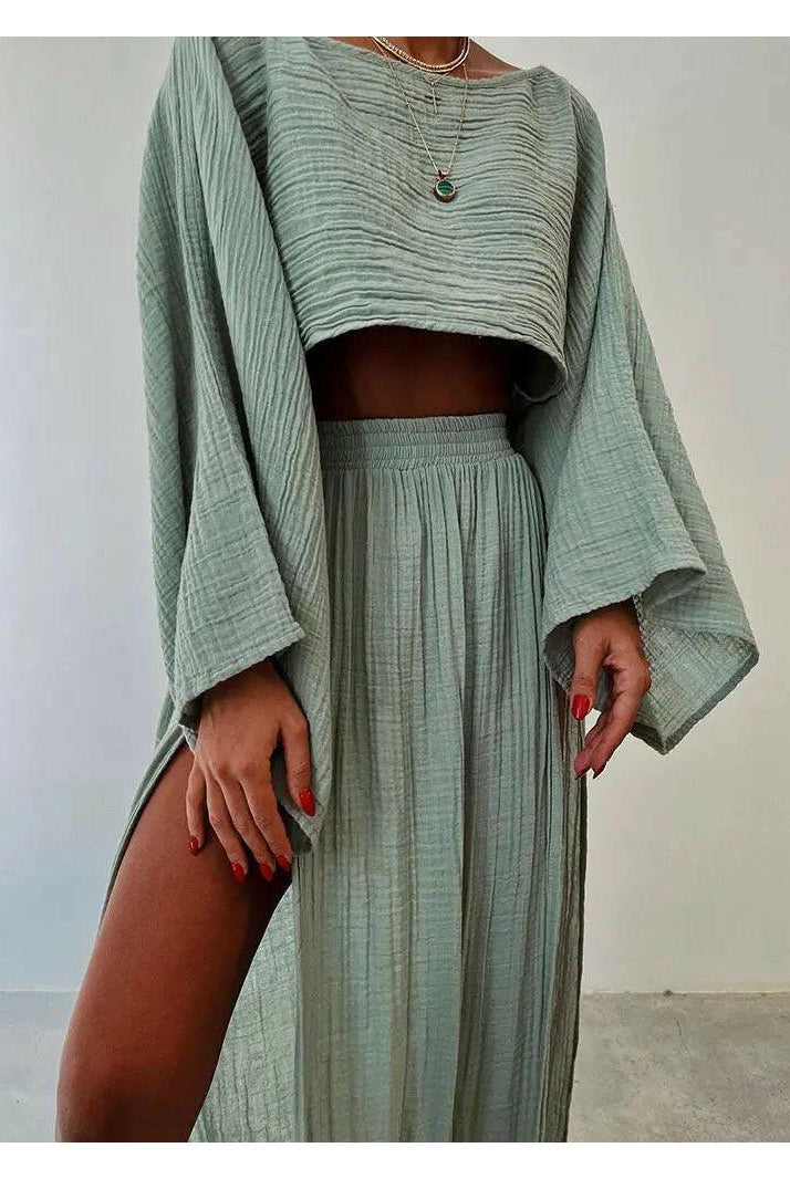 Green Laure Two-Piece Set by Lumina Wear featuring a stylish top and matching pants on a model.