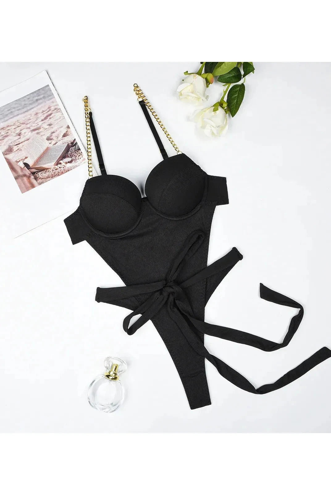 Lumina Wear Gabriella's Bodysuit in black, form-fitting with long sleeves and seamless design, displayed on a model.