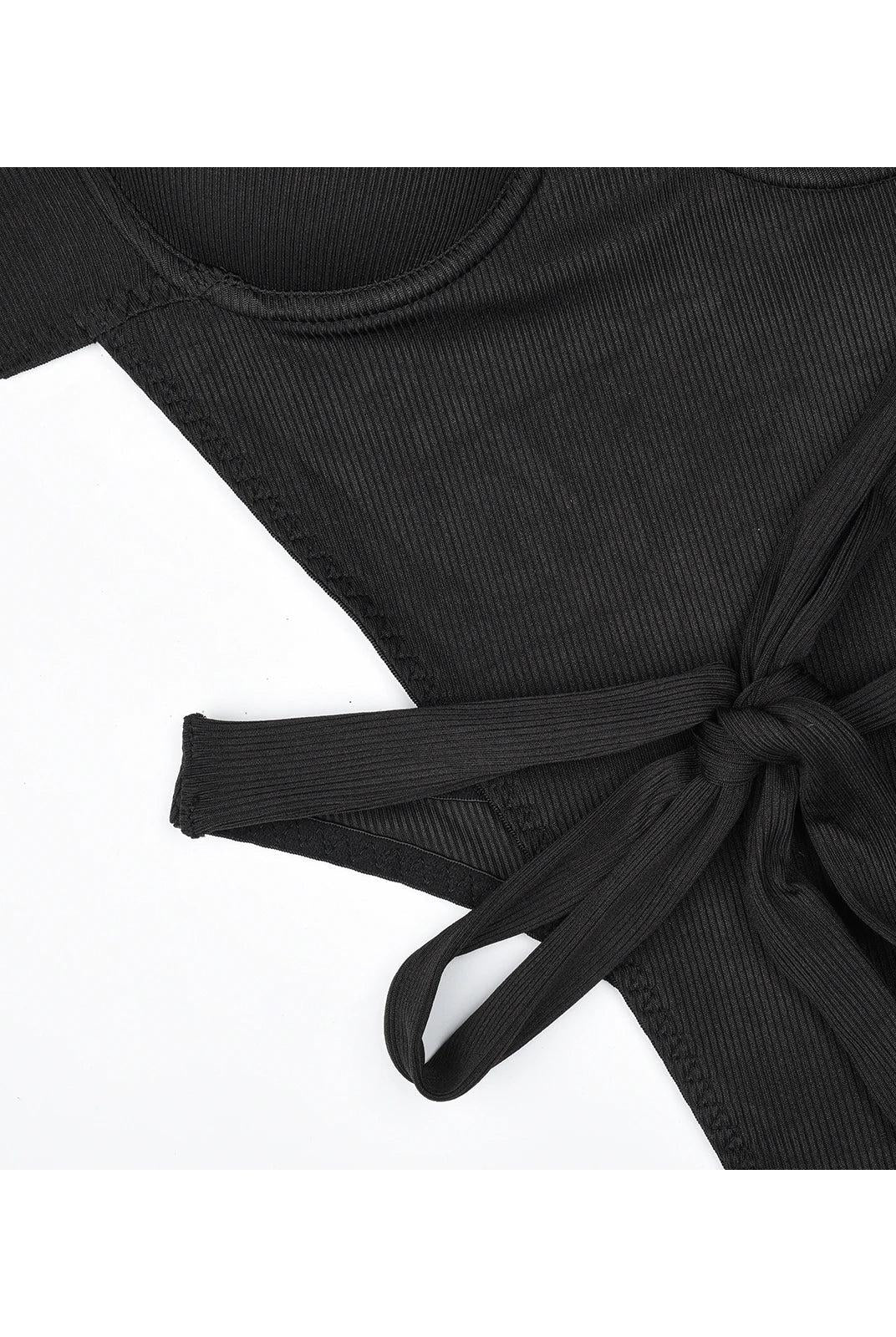 Lumina Wear Gabriella's bodysuit in black, form-fitting with long sleeves, displayed on a mannequin.