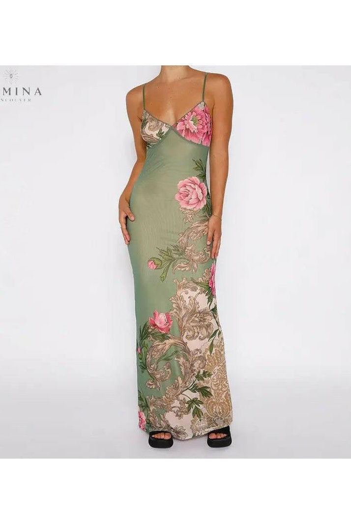 Green Gaia flower dress by Lumina Wear featuring a floral pattern, perfect for holiday vibes, size 8-10, on a model.