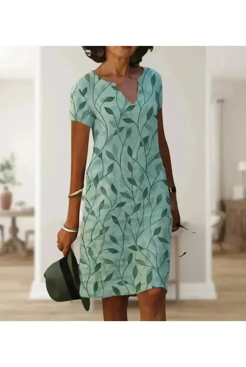 Green Galina casual floral print dress by Lumina Vancouver, featuring elegant design and lightweight fabric.