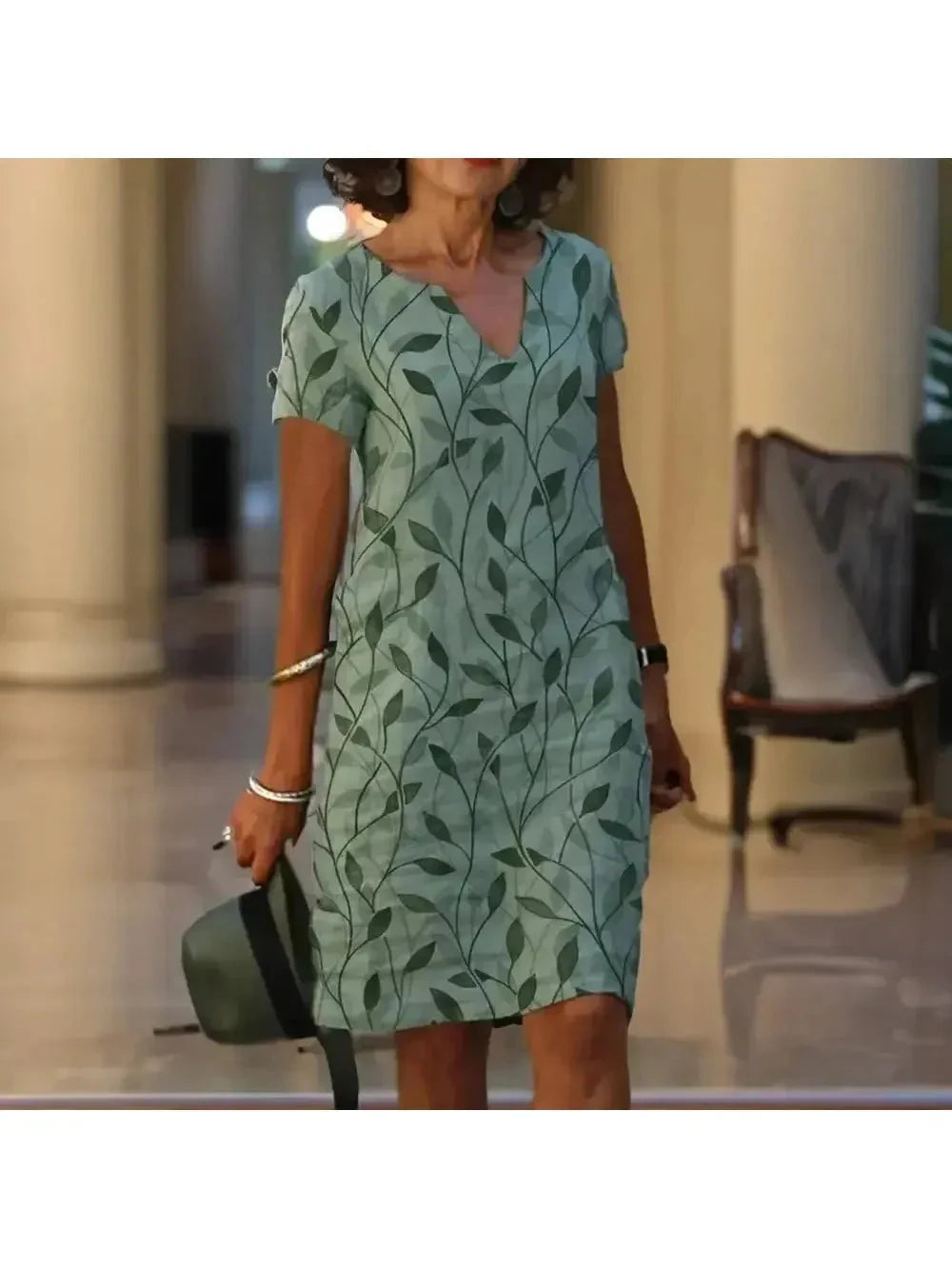 Green Galina casual elegant floral print dress by Lumina Vancouver, featuring a relaxed fit and vibrant floral design.
