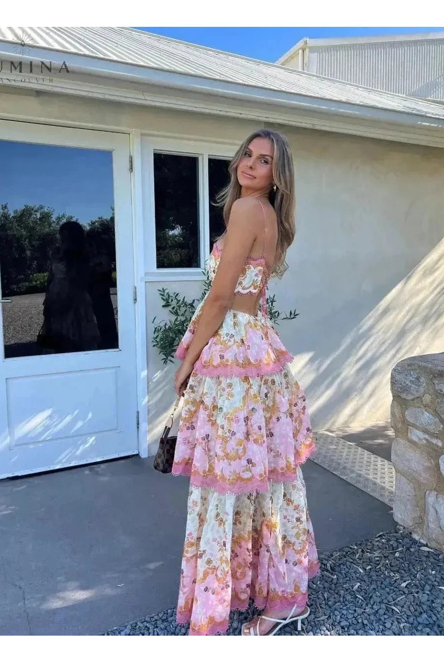 Lumina Wear Ghita maxi summer dress in floral fabric, perfect for wedding guests, displayed on a hanger with a light background.