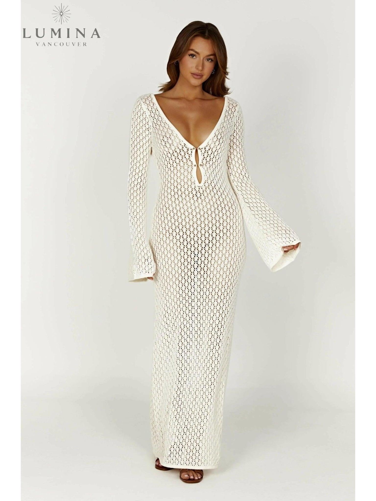 Elegant white dress by Lumina Vancouver, perfect for holiday vibes, featuring flowing fabric and a stylish, sophisticated design.
