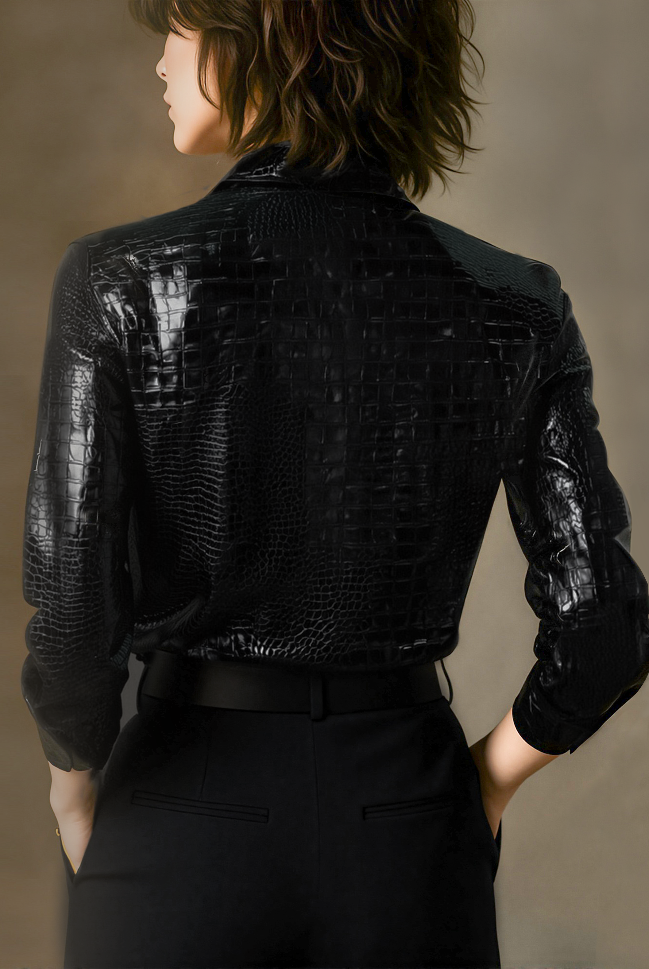 Lumina Wear Marcheline glossy black crocodile embossed blouse, showcasing a sleek, fitted black shirt with textured crocodile pattern.