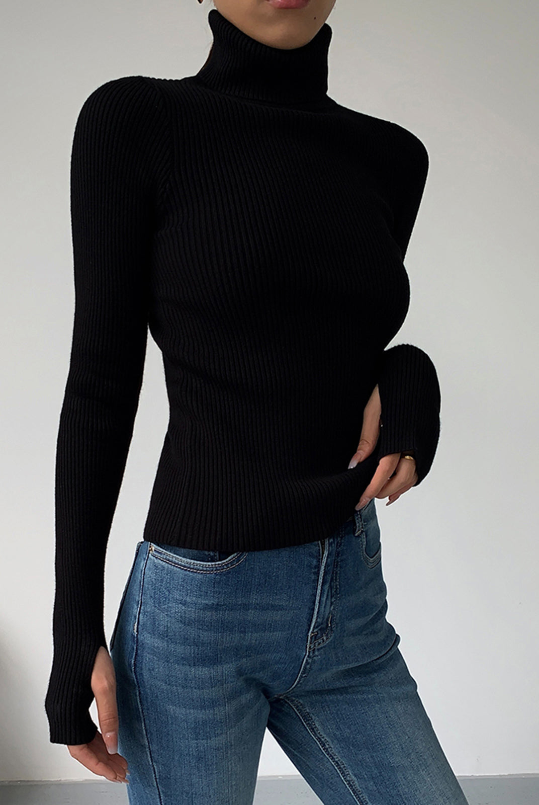 Dark brown Hailey Lumina Wear minimalist turtleneck top for winter, shown on a model, showcasing sleek and elegant winter style.
