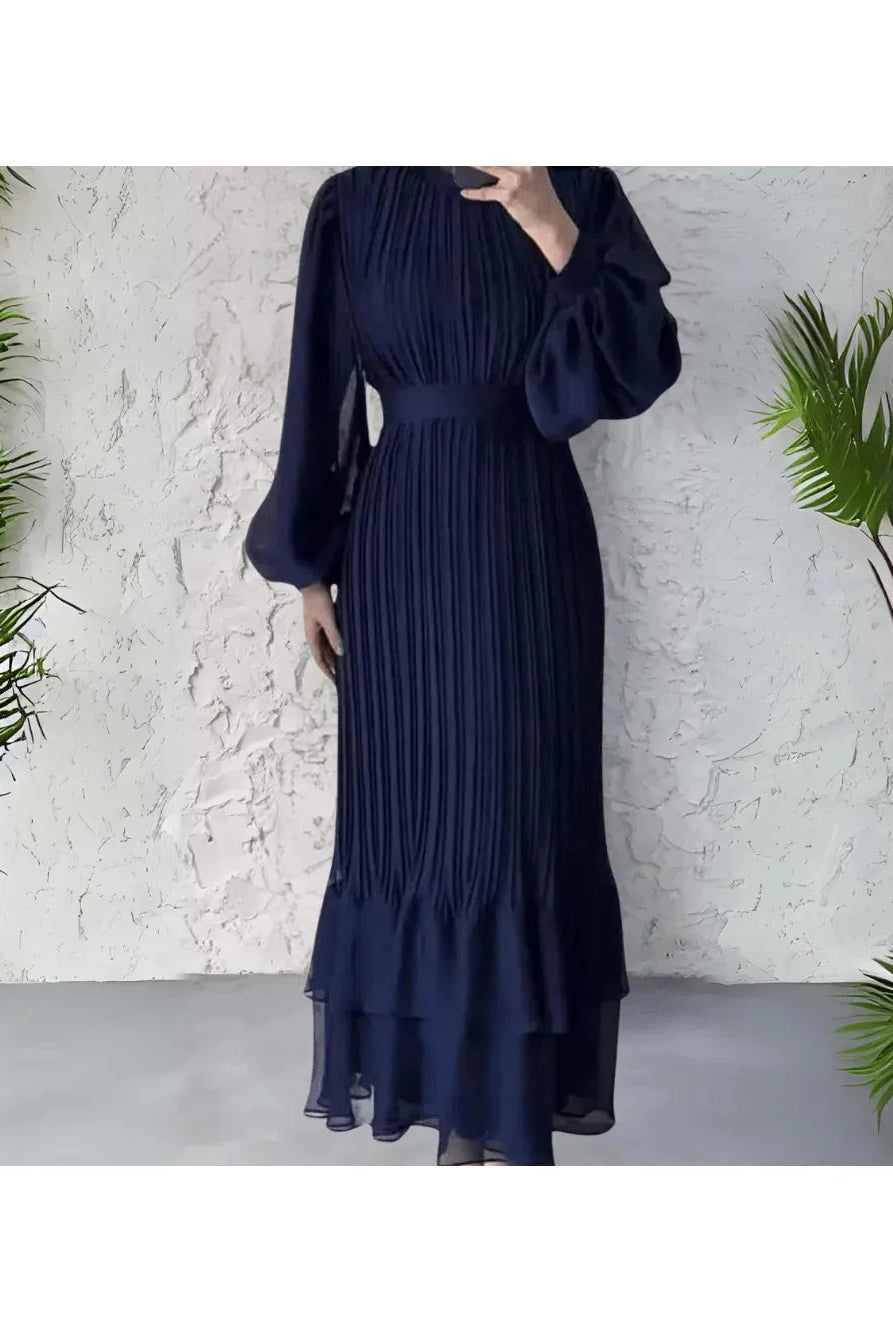 Blue Hannah pleated elegant dress by Lumina Wear, stylish and flowing with a sophisticated design perfect for formal occasions.