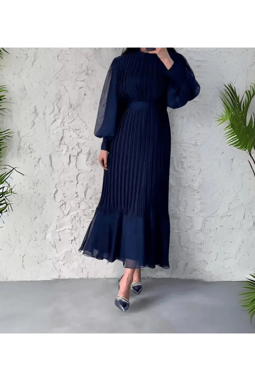 Blue Hannah pleated elegant dress by Lumina Wear, showcasing a stylish, flowing design perfect for formal occasions.