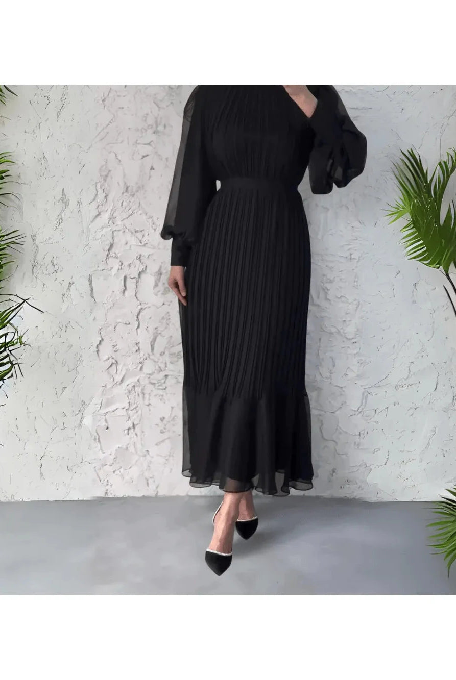 Blue Hannah pleated elegant dress by Lumina Wear, showcasing a flowing design and sophisticated style.