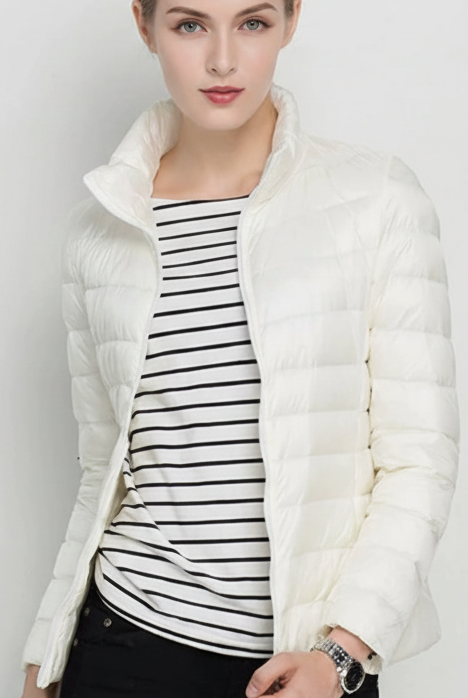 Harriet Lumina Wear lightweight black puffer jacket with stand collar, displayed in XS size, perfect for cold weather.
