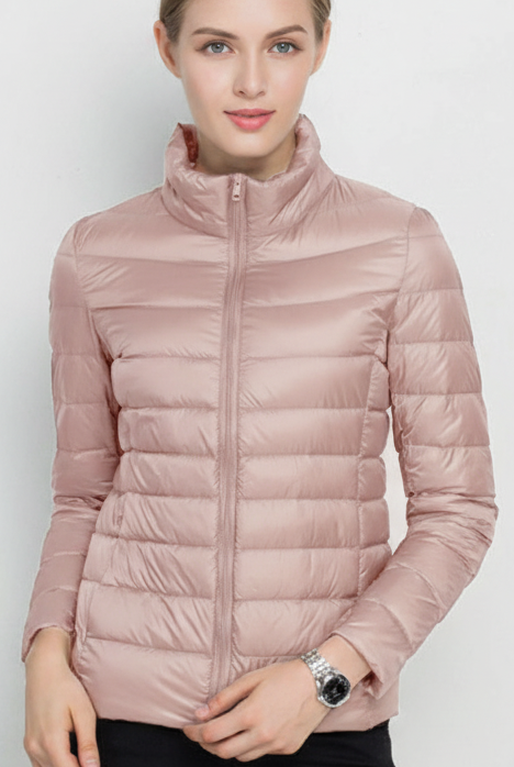Harriet lightweight black puffer jacket with stand collar by Lumina Wear, shown in XS size on a model.