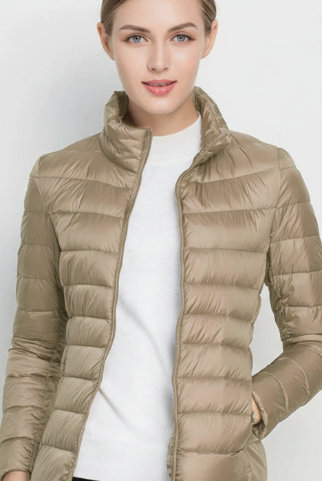 Harriet lightweight black puffer jacket with stand collar by Lumina Wear, shown in XS size with a sleek, stylish design.