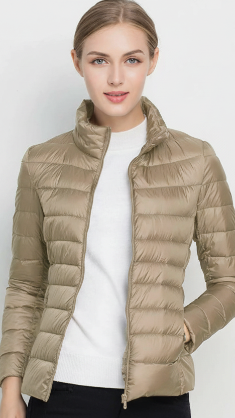 Harriet lightweight black puffer jacket with stand collar by Lumina Wear, shown in XS size with a sleek, stylish design.