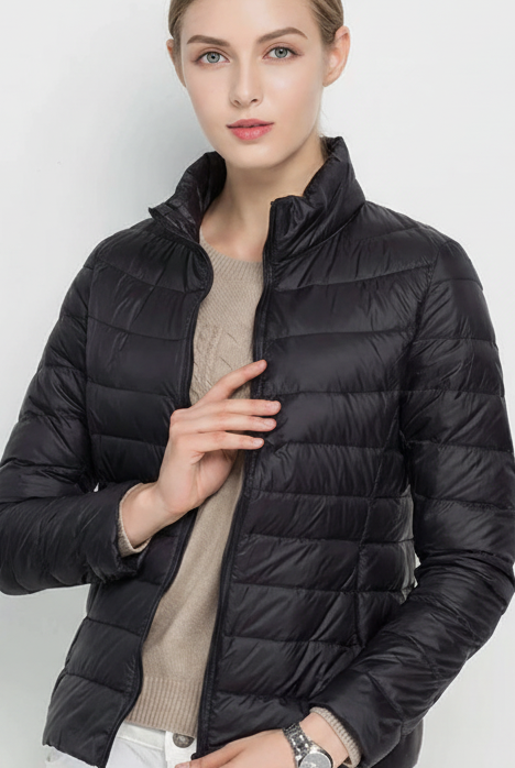 Harriet lightweight black puffer jacket with stand collar by Lumina Wear, shown in matcha color, XS size.