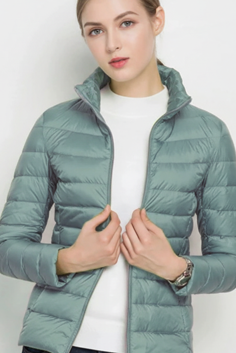 Harriet Lumina Wear lightweight black puffer jacket with stand collar, shown in XS size, stylish and warm outdoor outerwear