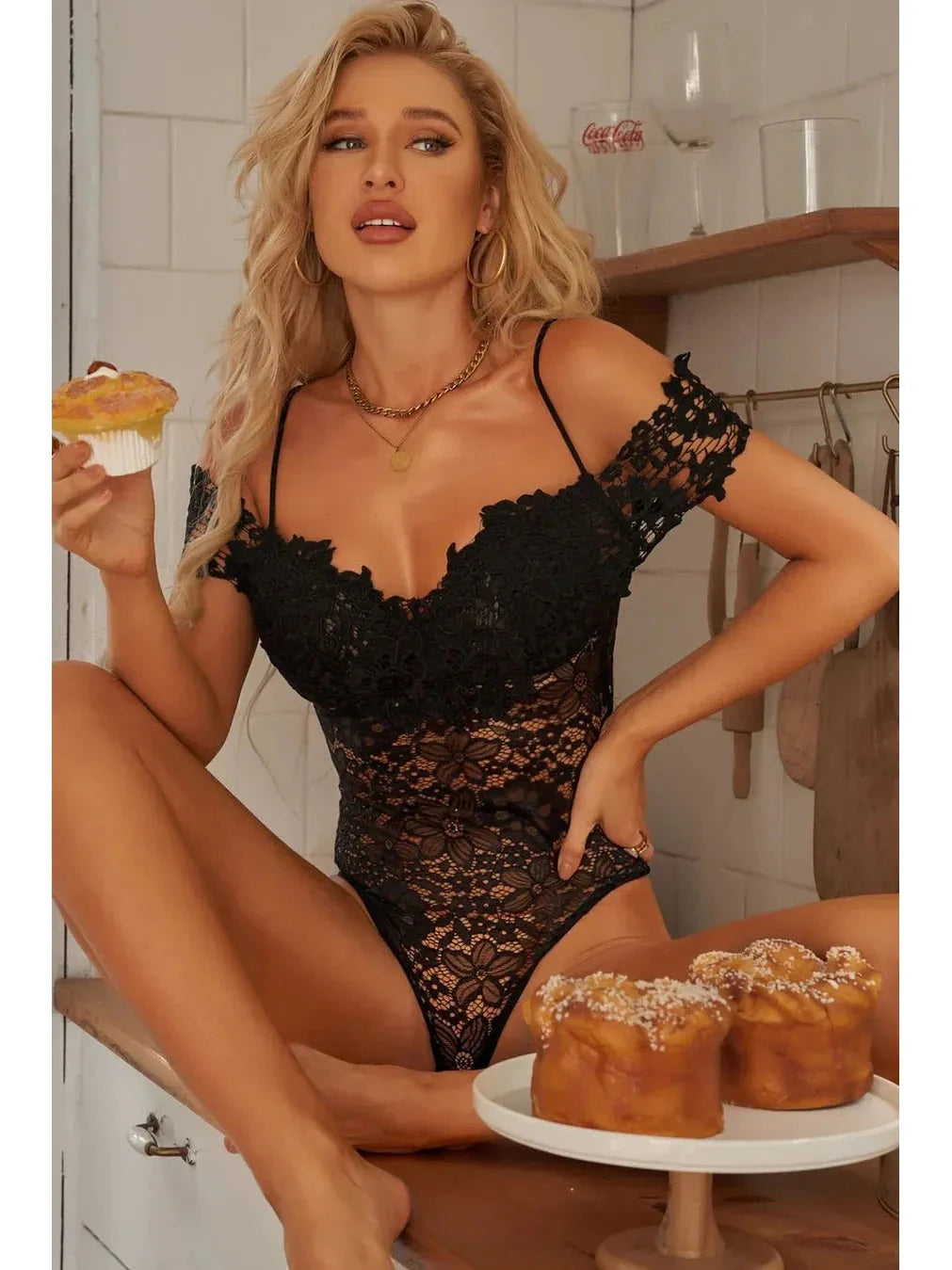 Lumina Vancouver Haven Bodysuit in black, form-fitting with long sleeves, shown on a model, stylish and sleek for modern fashion.