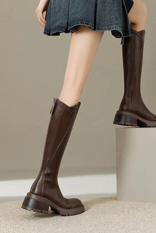 Elegant black knee-high boots for women with orthopedic support by Lumina Wear, featuring a cozy fur lining.