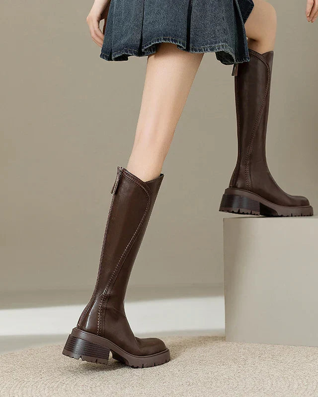 Elegant black knee-high boots with orthopedic support by Lumina Wear, featuring a brown fur lining for women.
