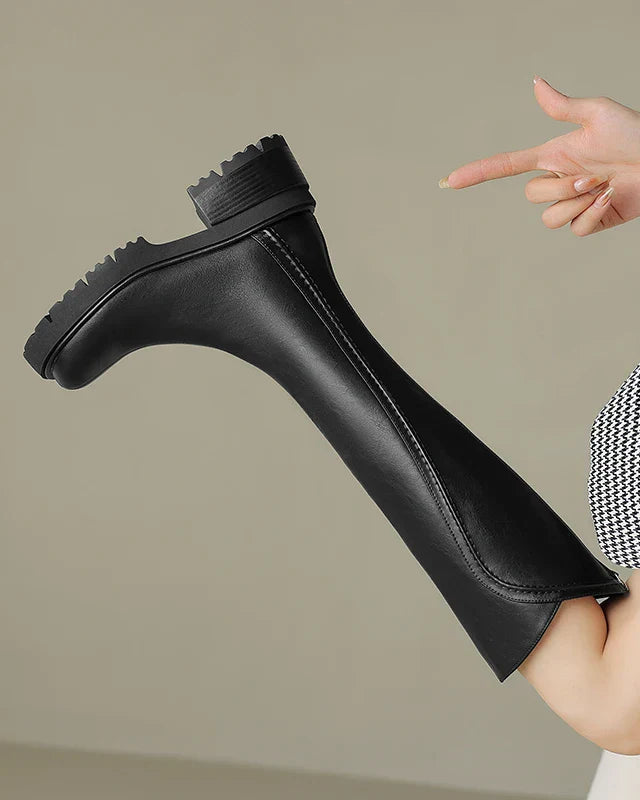 Elegant black knee-high boots by Lumina Wear with orthopedic support and brown fur trim, designed for comfort and style.