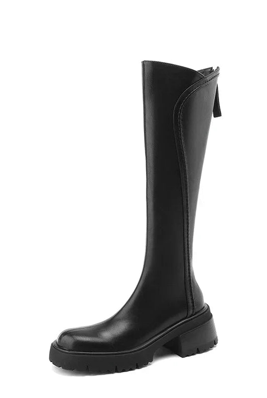 Elegant black knee-high boots for women by Lumina Wear with orthopedic support and brown fur accents.