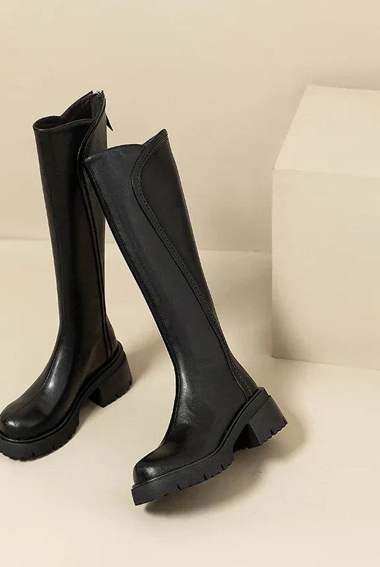 Elegant black knee-high women's boots with orthopedic support by Lumina Wear, featuring a fur lining and stylish design.