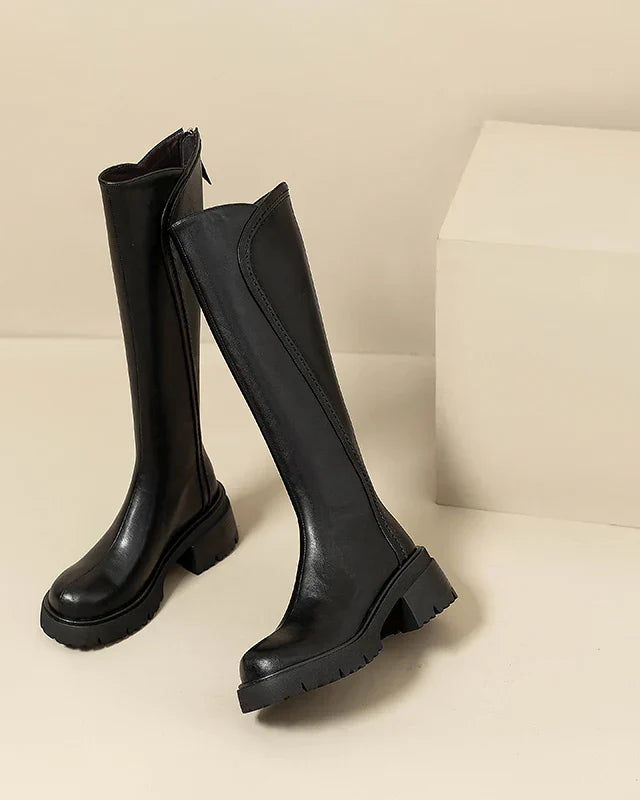 Elegant black knee-high boots by Lumina Wear featuring orthopedic support and brown fur accents for women.