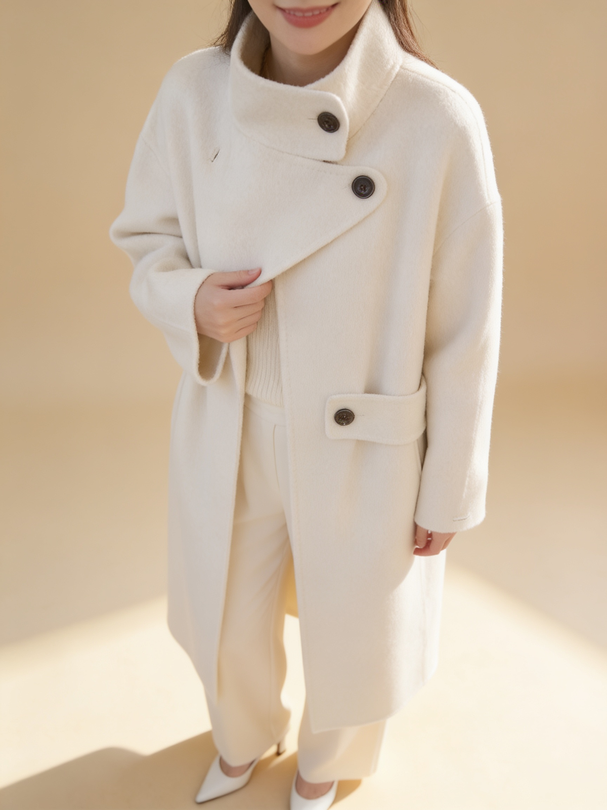 Lumina Wear structured asymmetrical button coat in Elena Frost style, shown in a clean silhouette
