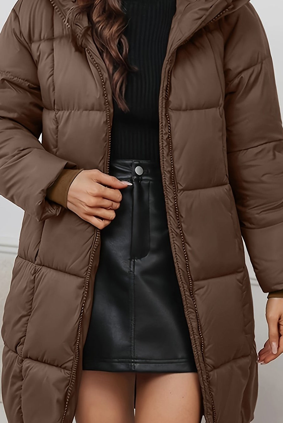 Redish-brown Lumina Wear Holly longline hooded puffer coat with minimalist design, cozy and warm for cold weather.