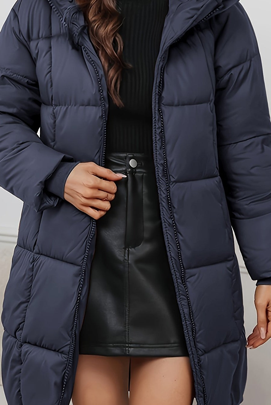 Redish-brown Holly longline hooded puffer coat by Lumina Wear, featuring a minimalist design and cozy, insulated puffer style.