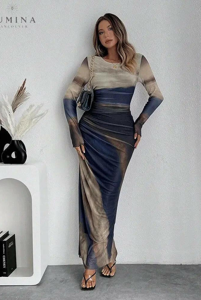 Dark blue Inara Dream Maxi Dress by Lumina Wear, elegant wedding guest dress with flowy fabric and fitted waist, size XS.