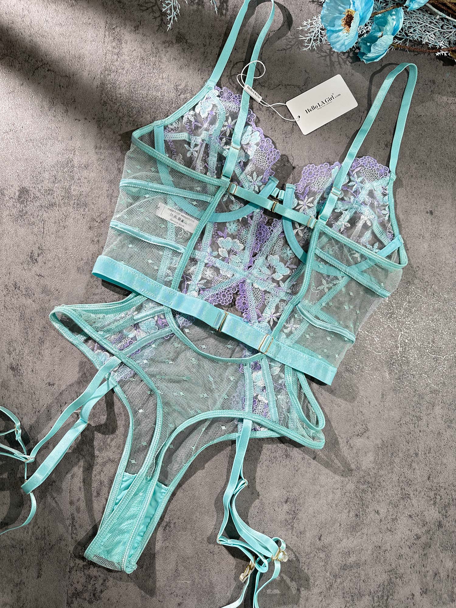 Blue Indigo Dreams floral French-inspired sensual bodysuit by Lumina Vancouver, showcasing delicate lace and elegant design.