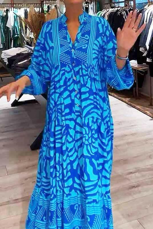 Blue Irene™ Vibrant Printed Dress by Lumina Vancouver, showcasing bold patterns and flowing fabric, perfect for stylish occasions.