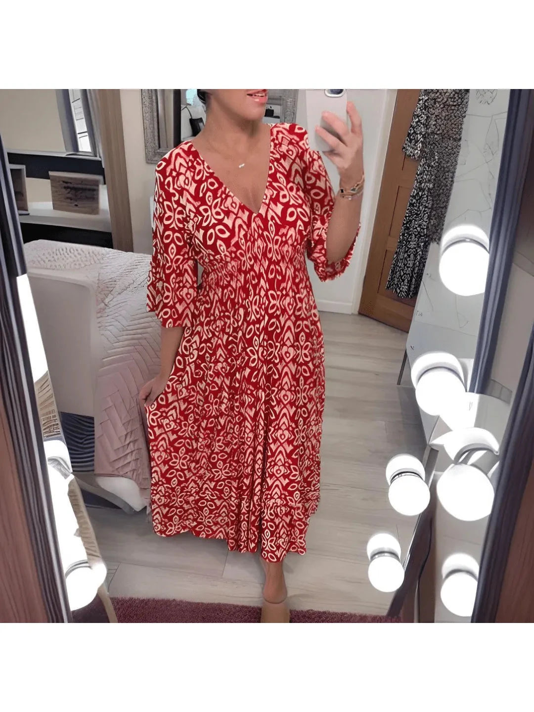 Red Elviira boho printed dress by Lumina Vancouver featuring a relaxed fit and vibrant floral pattern.