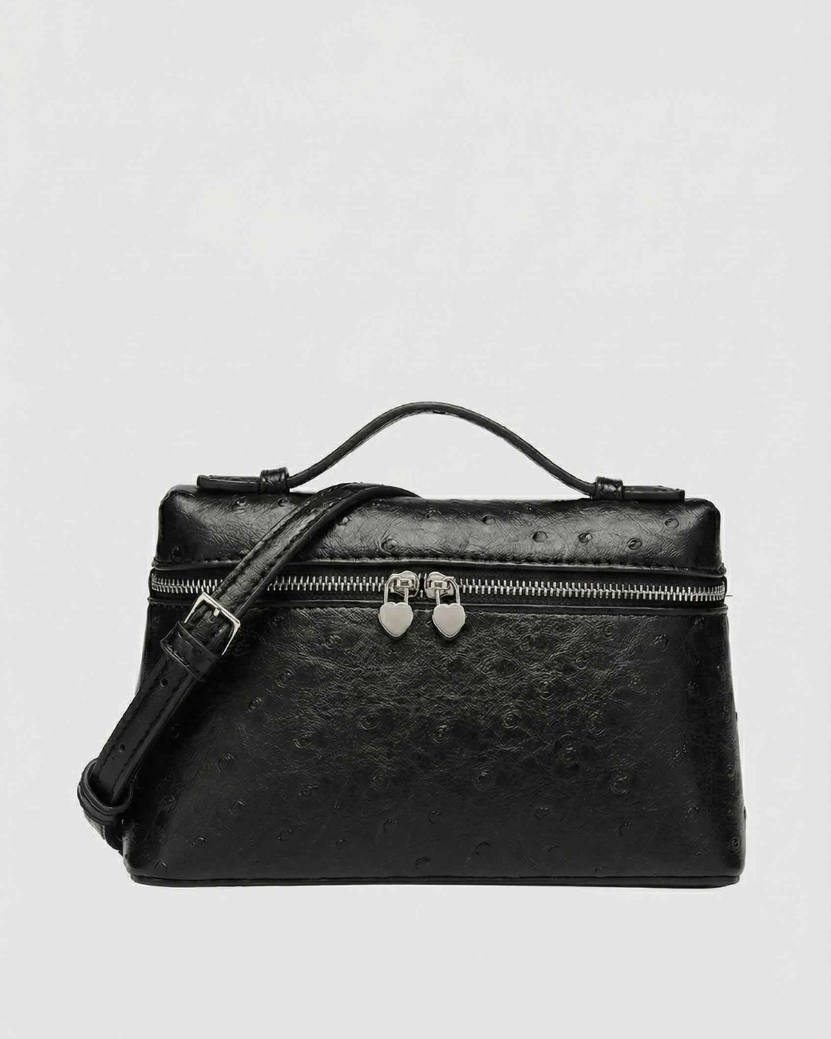 Black Lumina Wear Isabella crossbody handbag with adjustable strap, stylish and compact for everyday use.
