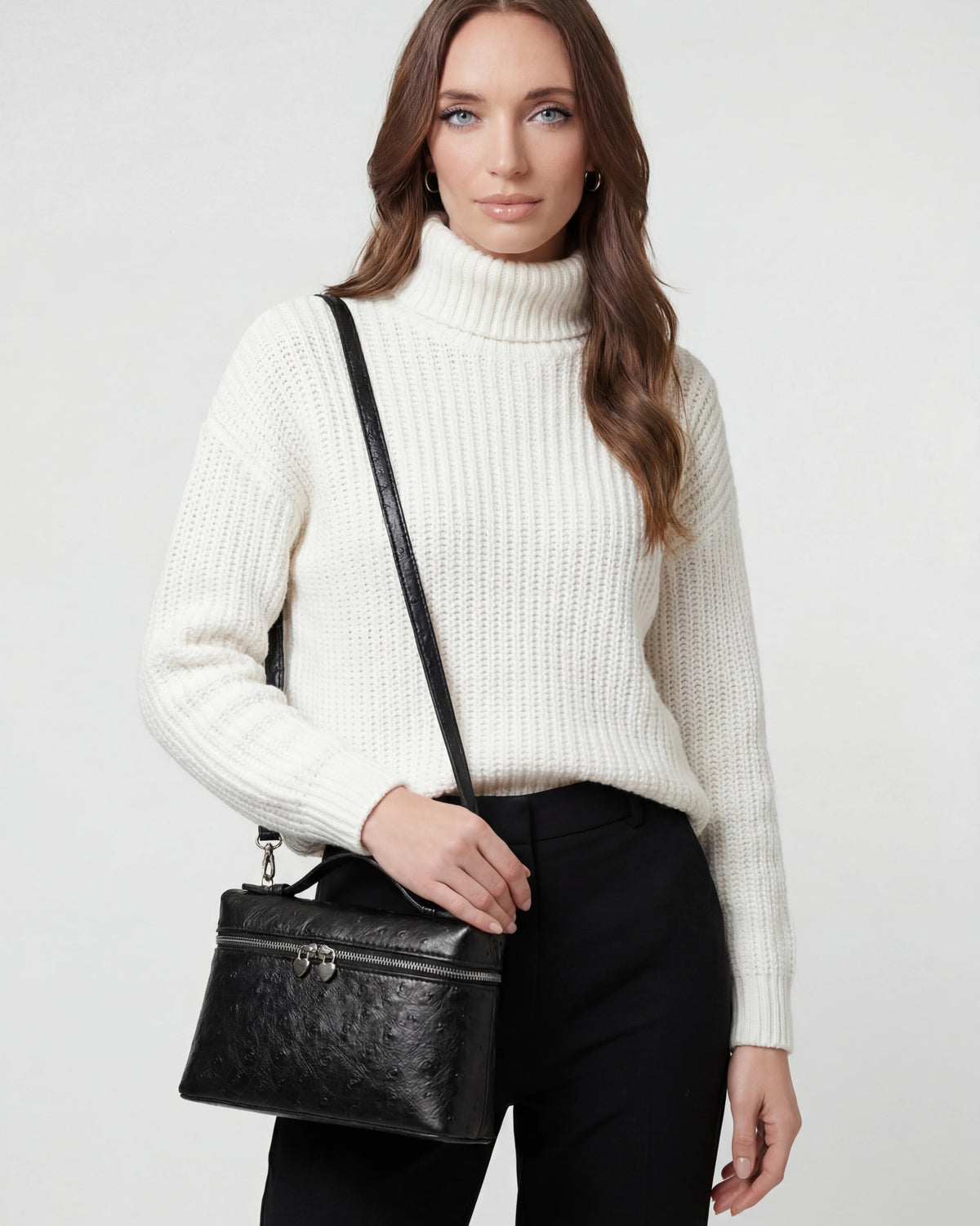 Lumina Wear Isabella black crossbody handbag with adjustable strap, stylish and compact for everyday use.
