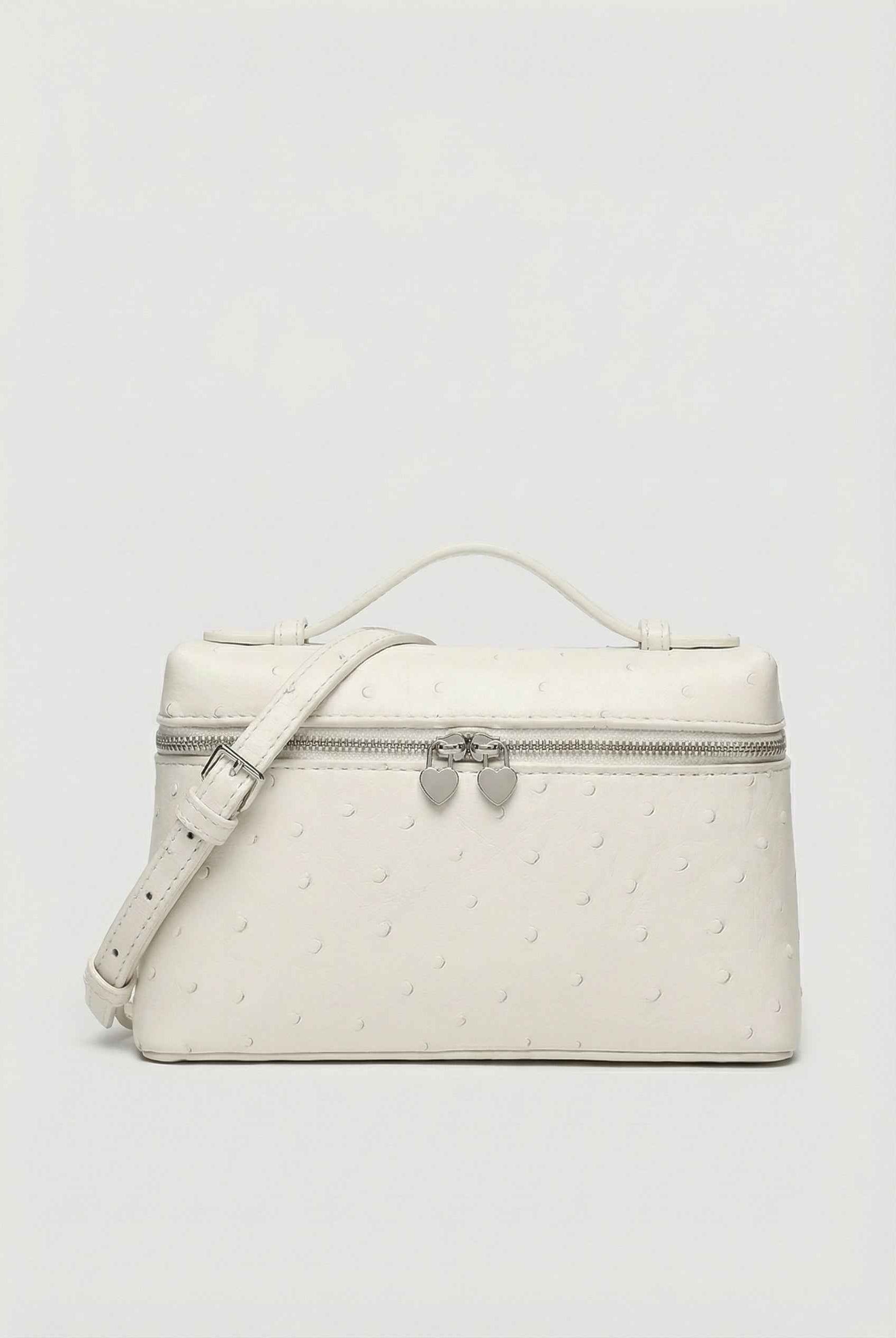 Lumina Wear Isabella black crossbody bag with adjustable strap, featuring a chic design and compact silhouette for everyday use.