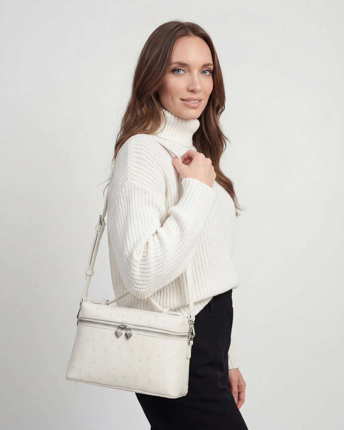 Lumina Wear Isabella black crossbody handbag with adjustable strap, stylish and compact for everyday use.