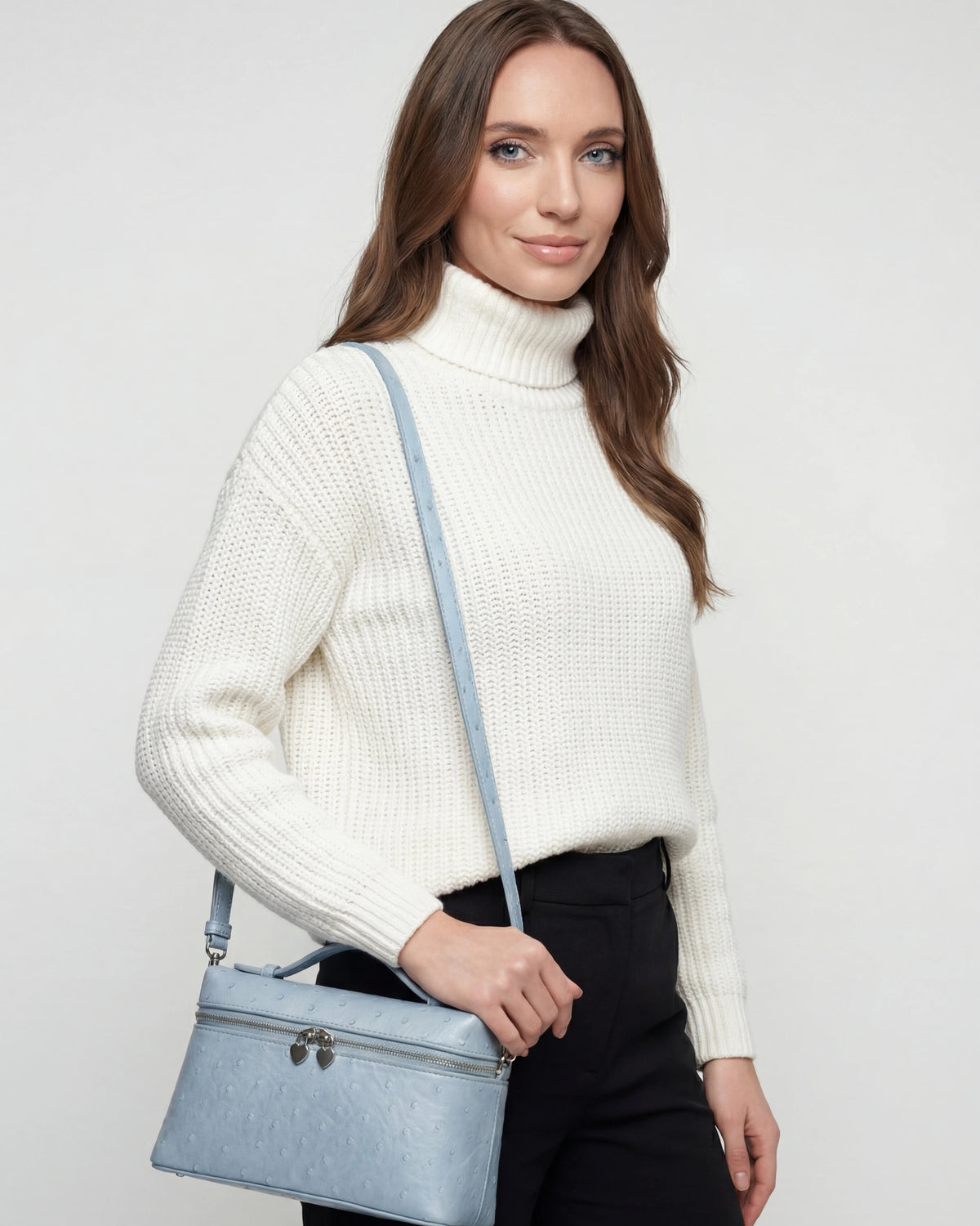 Lumina Wear Isabella black crossbody handbag with adjustable strap, stylish and compact for everyday use.